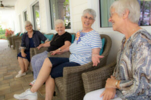 residents smiling and laughing with friends