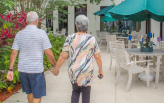 Buena Vida residents walking while holding hands