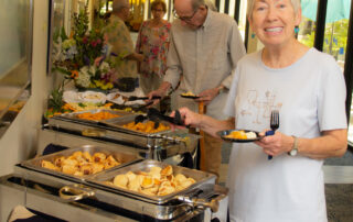 buena vida residents enjoying a buffet