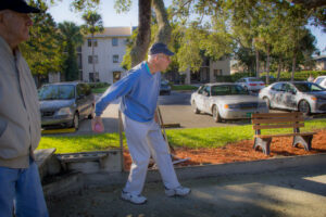 active senior resident playing bocce ball