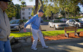 active senior resident playing bocce ball