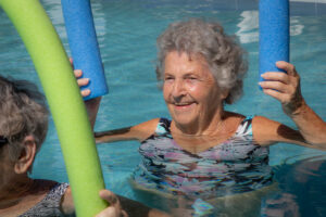 resident enjoying our pool activities at buena vida estates