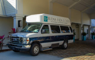 Buena Vida Estates entrance and transportation van