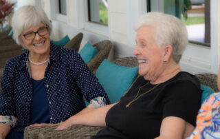 residents laughing together on patio