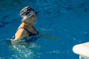 buena vida resident smiling in pool