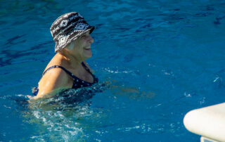 buena vida resident smiling in pool